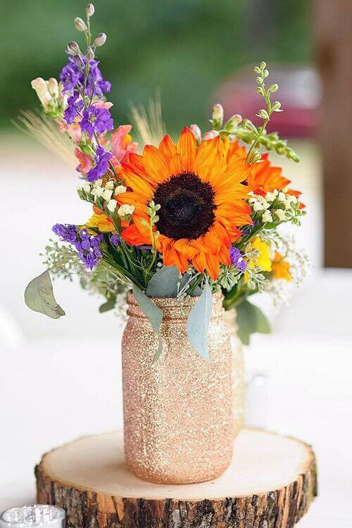 Arranging flowers in mason jar