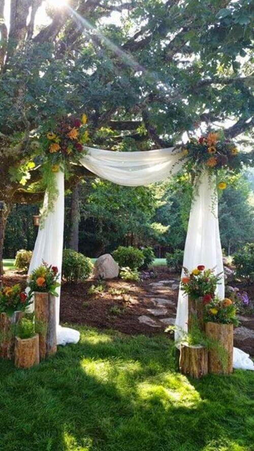 decorating wedding outdoor with white fabric