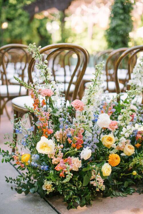 bright flowers wedding aisle decor