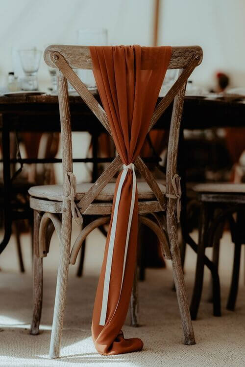 chair decor with burnt orange fabric