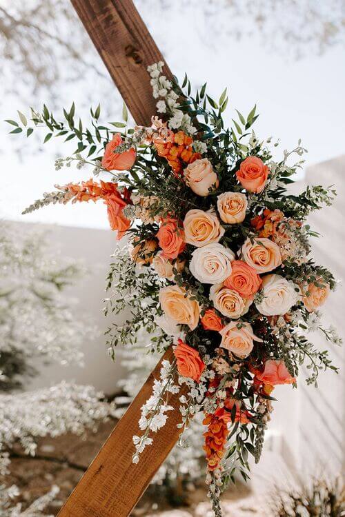 hexagon arch with burnt orange flowers