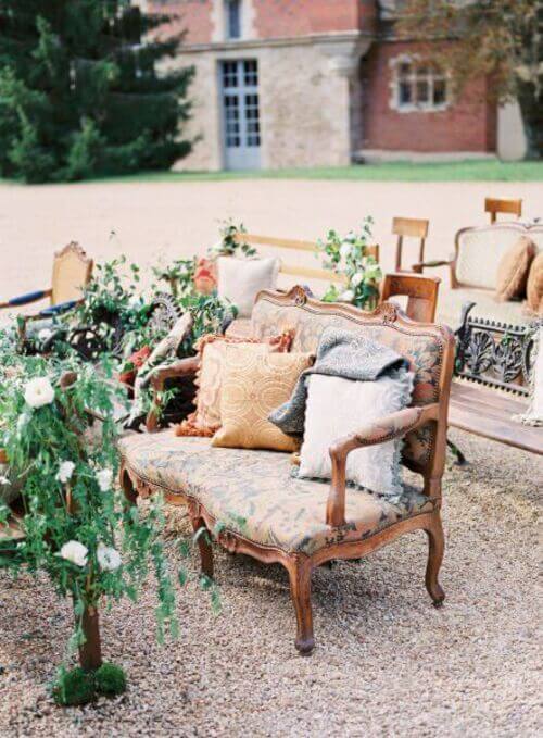rustic wedding aisle decor with vintage chairs