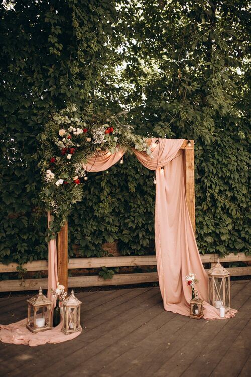 wedding arch with dusty rose and sage green