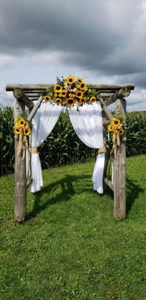 rustic wedding arch with sunflowers