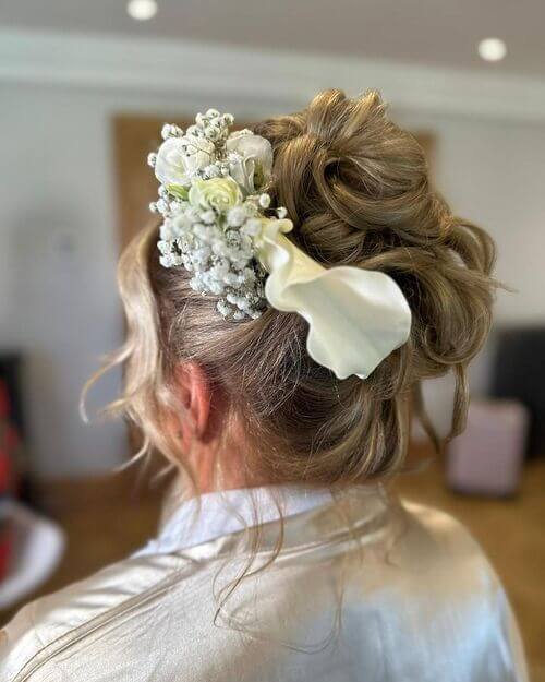 Curly Top Knot with Fresh Flower Adornment