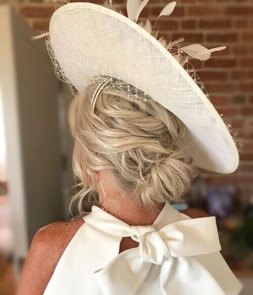 Messy Waves in Low Chignon Bun with Net Lace Fascinator