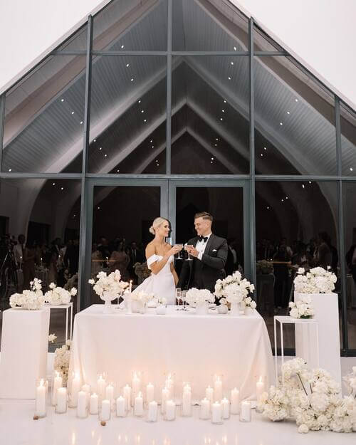 Black and white themed wedding white bride and groom table