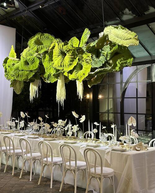 Black and white themed wedding table set up with plants