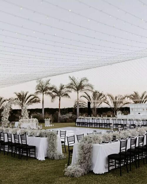 Black and white themed wedding tables and dancefloor