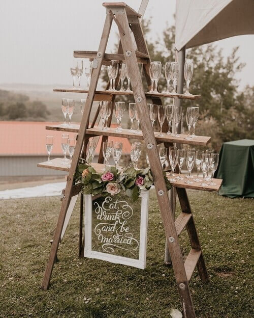 Rustic wedding drink set up using a ladder