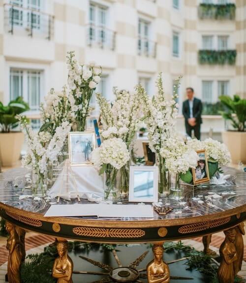 Round table with wedding display photos