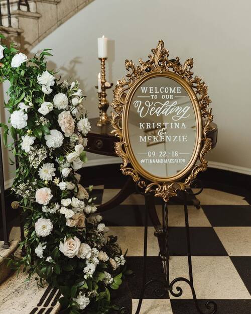 romantic welcome sign with gold mirror