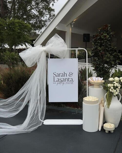 white stand wedding welcome sign