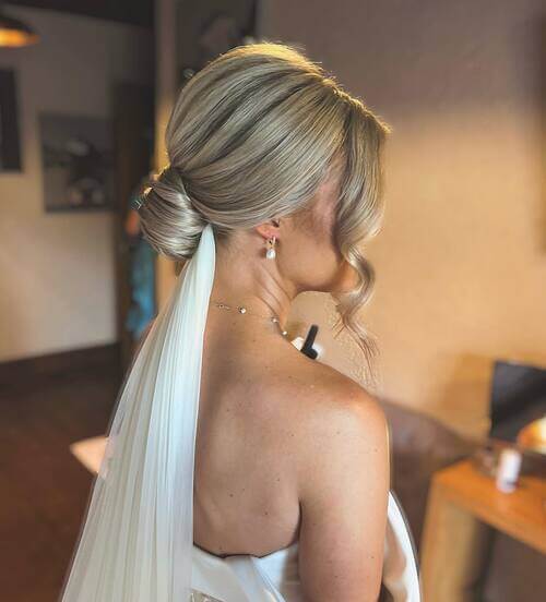 Slicked back bun and veil bridal hairstyle
