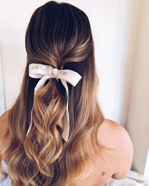 Half up half down with bow bridal hairstyle