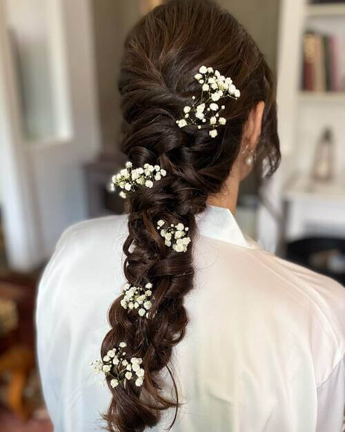 Braided bridal hairstyle with flowers