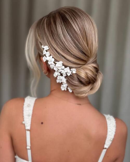 Low bun with floral hairpins