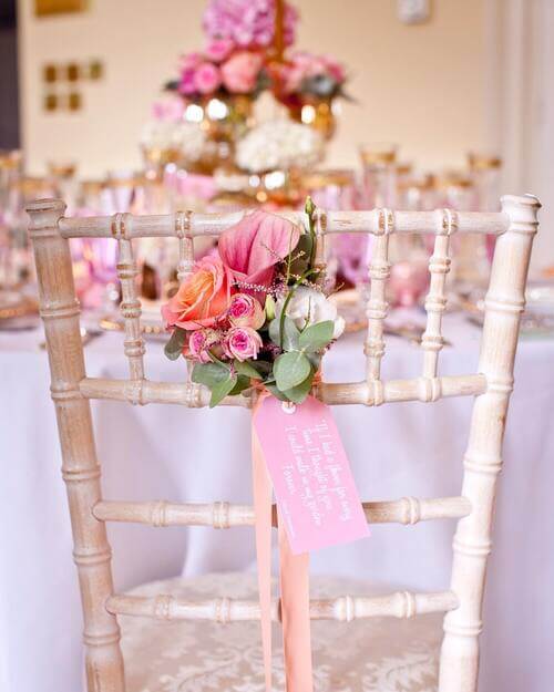 Small bouquet of flowers as wedding chair decor