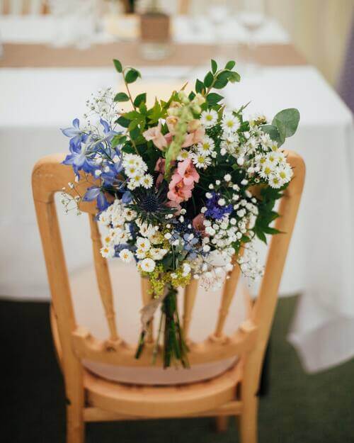 Flower bouquet on wedding chair