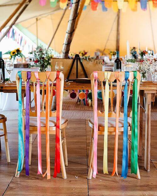 Colorful wedding chair decor with ribbons