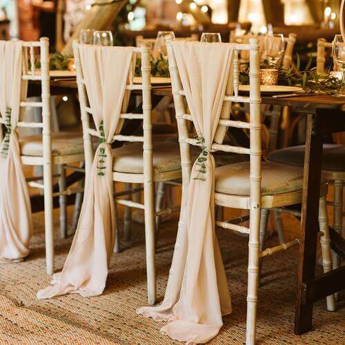 Elegant wedding chair decor with eucalyptus leaves