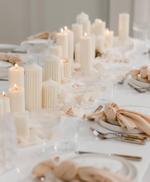 Different white candles wedding table decor