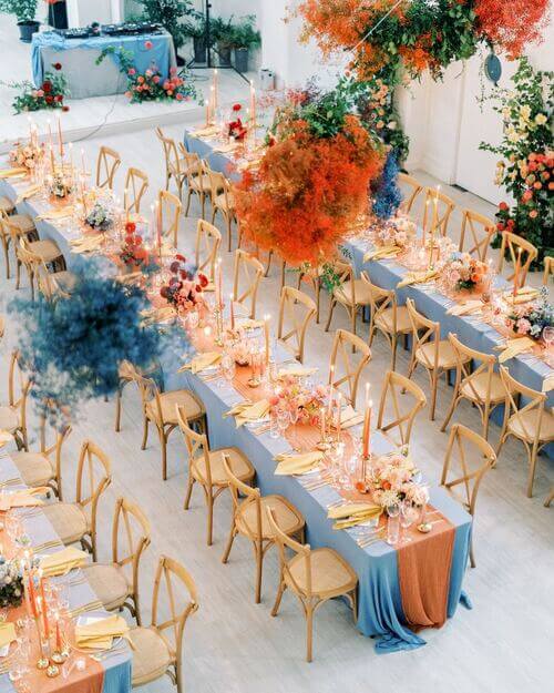 Contrasting colors blue and orange wedding table decor