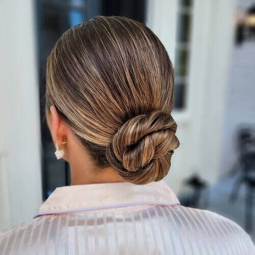 Sleek, chic low bun hairstyle idea for bridesmaids