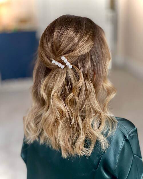 Mid-length tied back bridesmaid hairstyle