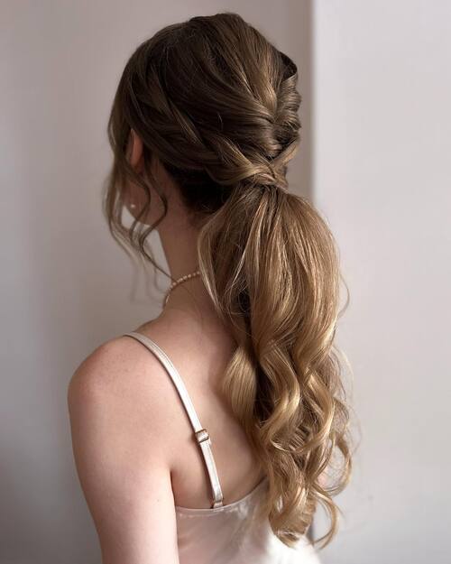 Braided low-rise ponytail bridesmaid hairstyle
