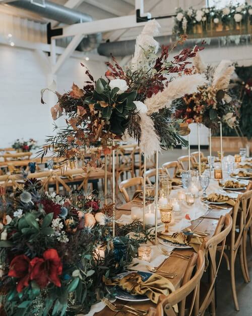 Fall wedding table scape foliage and candle sticks