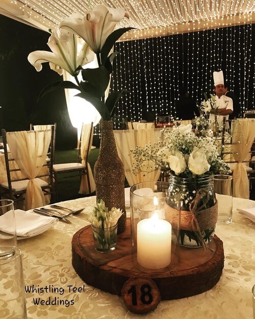 Rustic wedding table center piece tree stump table number