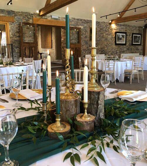 Rustic wedding table center piece with colorful candles