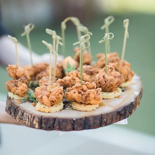 Wedding appetizer on tree stump platter