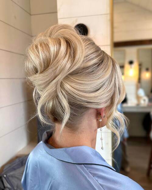 High twisted bun romantic wedding hairstyle