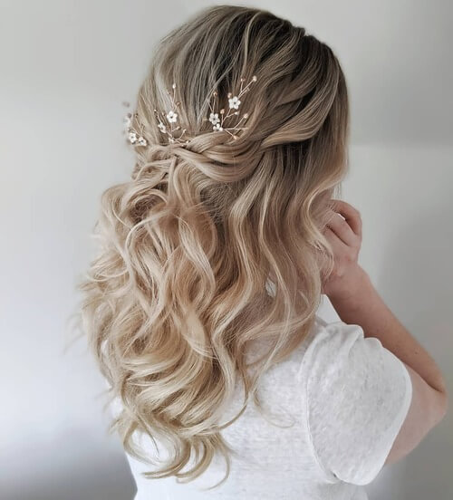 Curly pinned back romantic wedding hairstyle