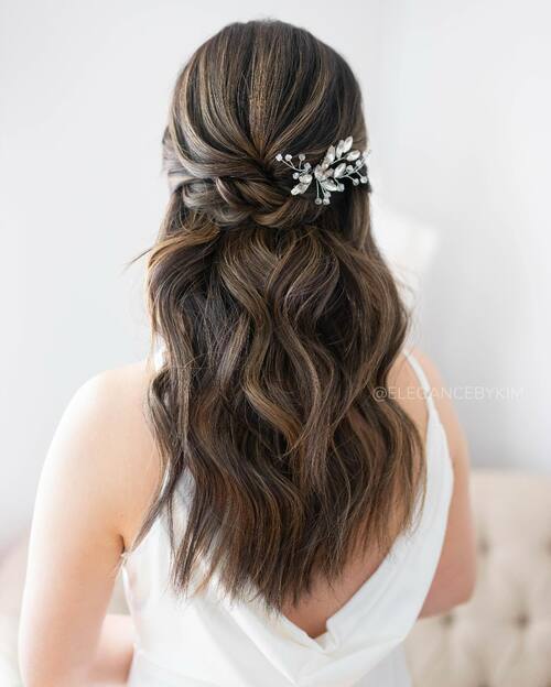 Twisted braid with hair piece romantic wedding hairstyle