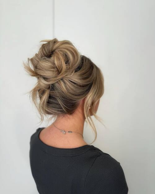 Pinned back high bun wedding up-do 