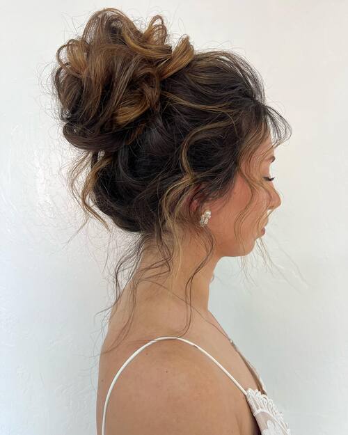 Curly messy bun wedding up-do