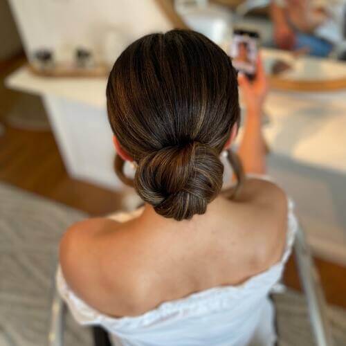 Slicked back low bun wedding up-do