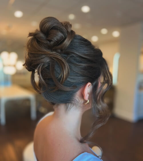 Wedding up-do high bun with pinned back look