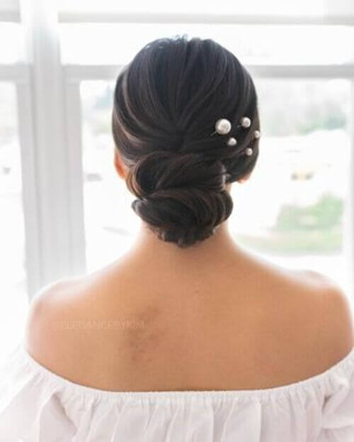 Simple wedding up-do with pearl pins