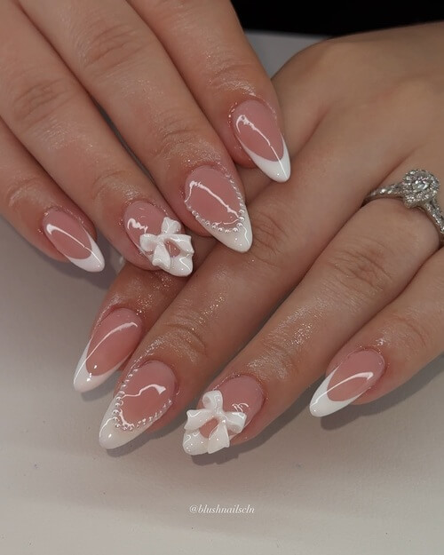 Added bow with French tips bridal nails